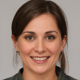 Joyful white young-adult female with medium  brown hair and brown eyes