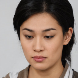 Neutral asian young-adult female with medium  brown hair and brown eyes