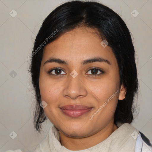 Joyful latino young-adult female with medium  brown hair and brown eyes