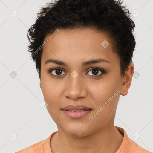 Joyful latino young-adult female with short  brown hair and brown eyes