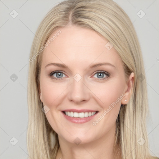 Joyful white young-adult female with long  brown hair and blue eyes