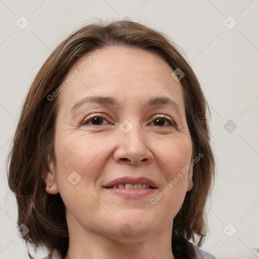 Joyful white adult female with medium  brown hair and grey eyes