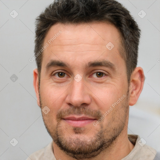 Joyful white adult male with short  brown hair and brown eyes