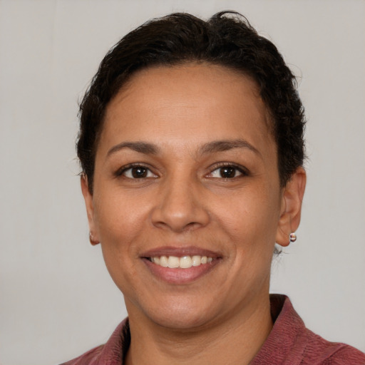 Joyful white adult female with short  brown hair and brown eyes