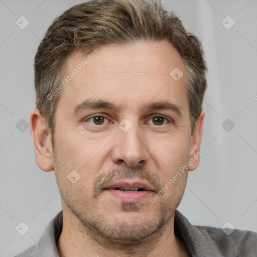 Joyful white adult male with short  brown hair and grey eyes