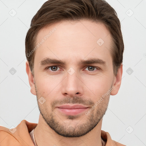 Joyful white young-adult male with short  brown hair and grey eyes