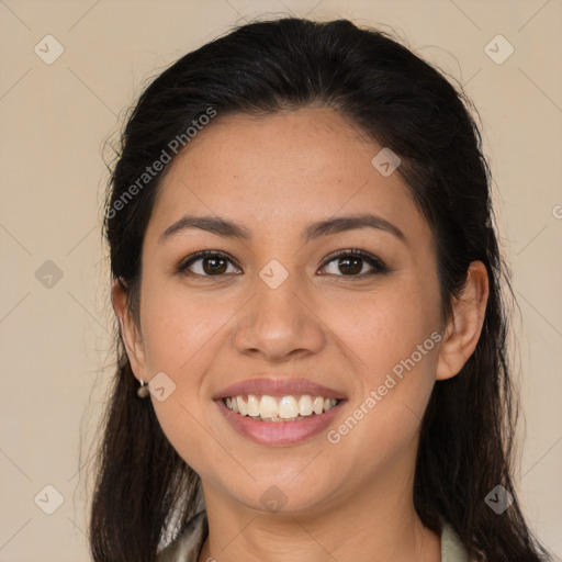 Joyful latino young-adult female with long  brown hair and brown eyes