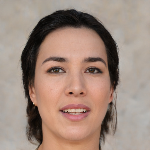 Joyful asian young-adult female with medium  brown hair and brown eyes