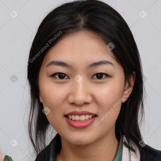 Joyful asian young-adult female with medium  black hair and brown eyes