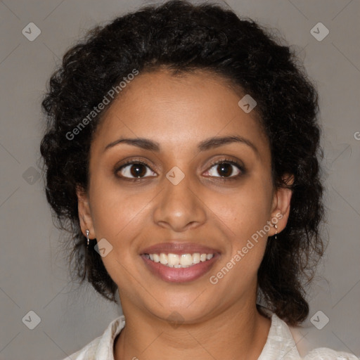 Joyful black young-adult female with medium  brown hair and brown eyes