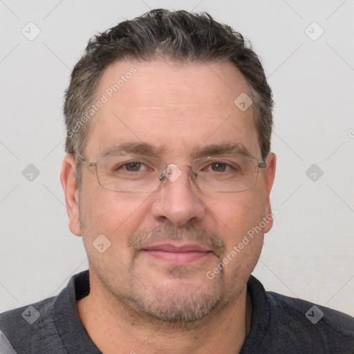 Joyful white adult male with short  brown hair and grey eyes