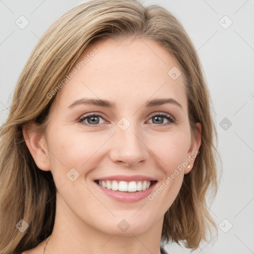 Joyful white young-adult female with medium  brown hair and green eyes