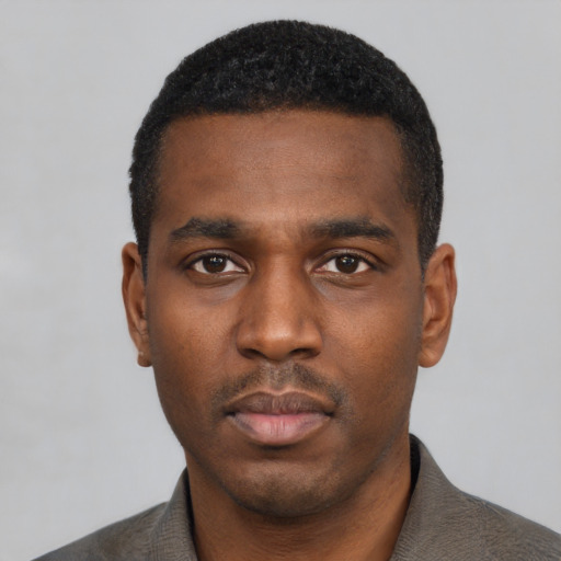 Neutral black young-adult male with short  black hair and brown eyes
