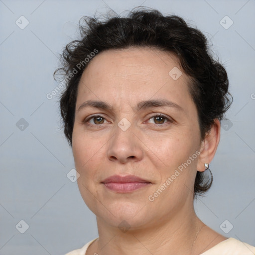 Joyful white adult female with short  brown hair and brown eyes