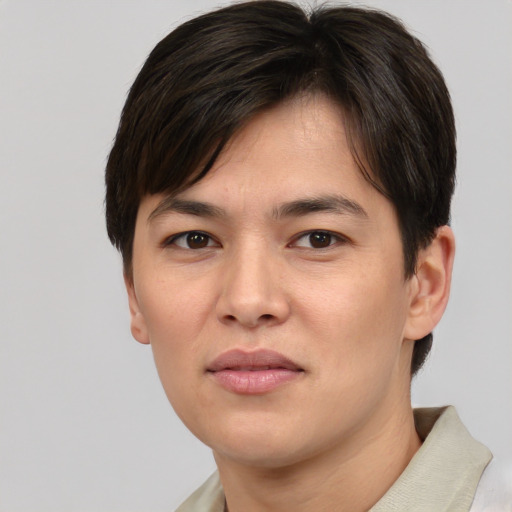 Joyful asian young-adult male with short  brown hair and brown eyes