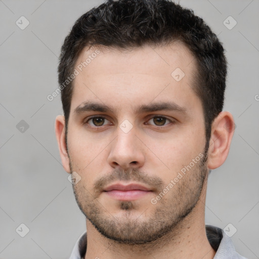 Neutral white young-adult male with short  brown hair and brown eyes