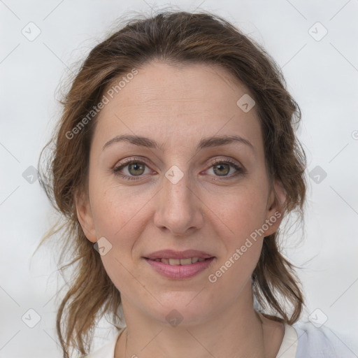 Joyful white adult female with medium  brown hair and grey eyes