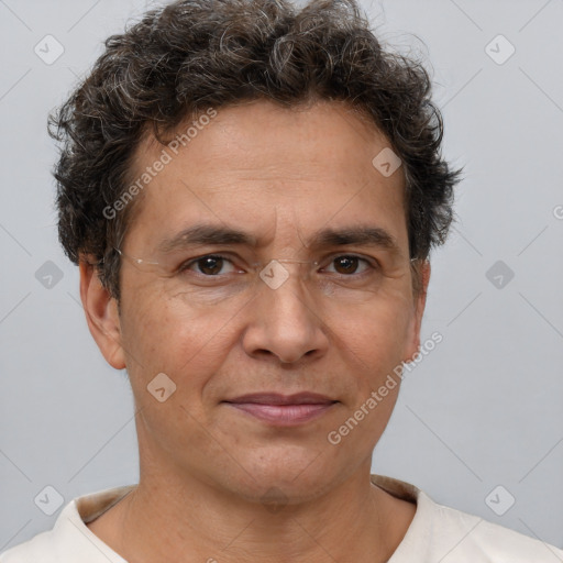 Joyful white adult male with short  brown hair and brown eyes