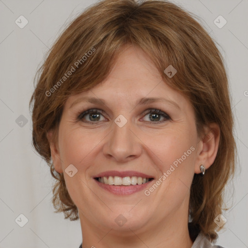 Joyful white adult female with medium  brown hair and grey eyes