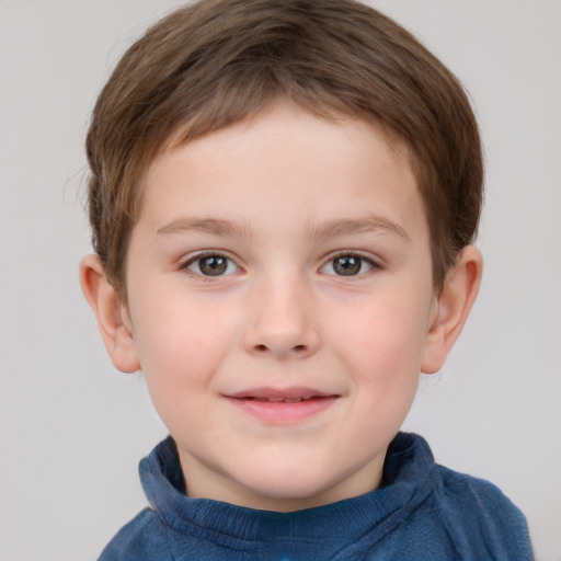 Joyful white child male with short  brown hair and grey eyes