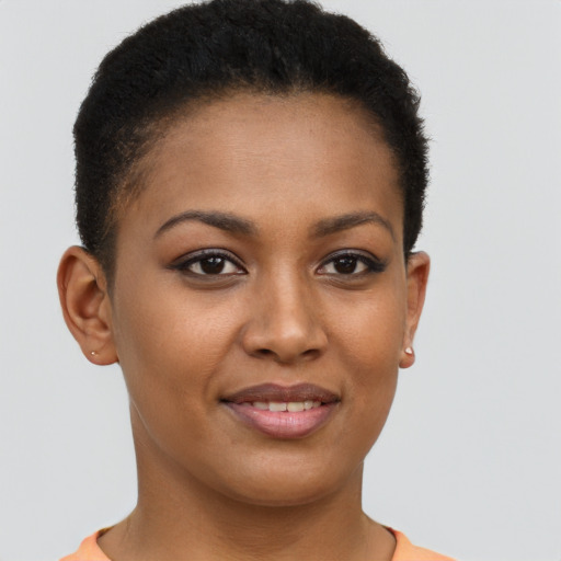 Joyful black young-adult female with short  brown hair and brown eyes