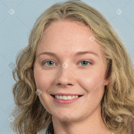 Joyful white young-adult female with medium  brown hair and green eyes