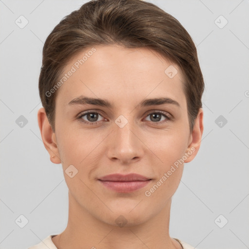 Joyful white young-adult female with short  brown hair and grey eyes