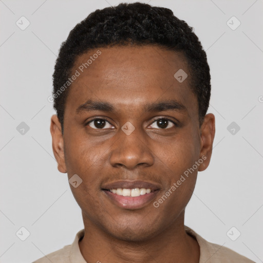 Joyful black young-adult male with short  black hair and brown eyes