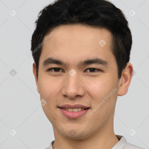 Joyful asian young-adult male with short  brown hair and brown eyes