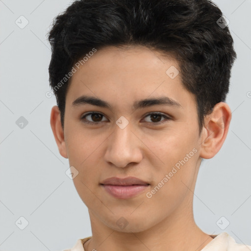 Joyful latino young-adult male with short  brown hair and brown eyes