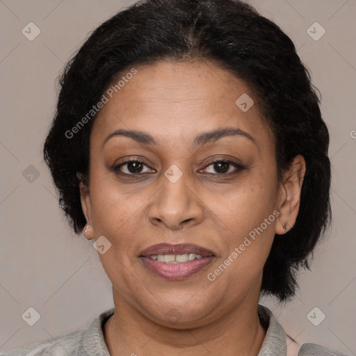 Joyful latino adult female with medium  brown hair and brown eyes
