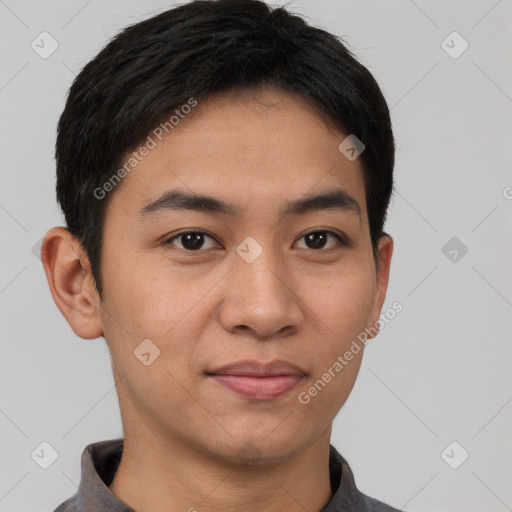 Joyful asian young-adult male with short  black hair and brown eyes