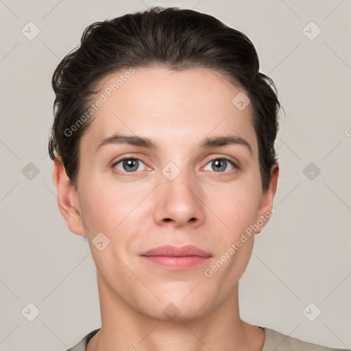 Joyful white young-adult female with short  brown hair and grey eyes