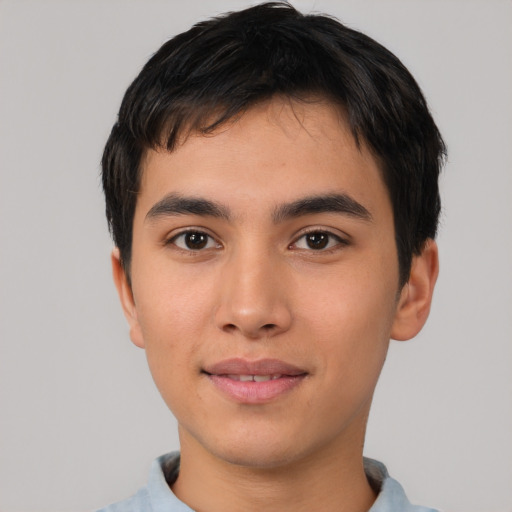 Joyful asian young-adult male with short  brown hair and brown eyes