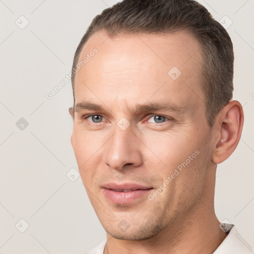 Joyful white adult male with short  brown hair and brown eyes