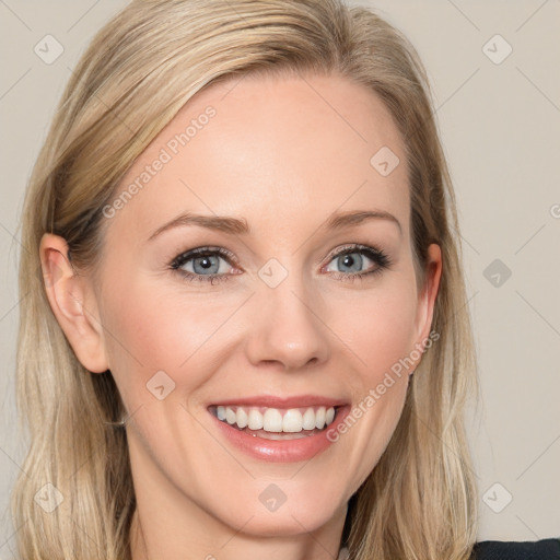 Joyful white young-adult female with long  brown hair and blue eyes