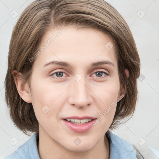 Joyful white young-adult female with medium  brown hair and blue eyes