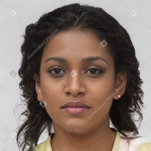 Joyful black young-adult female with long  brown hair and brown eyes