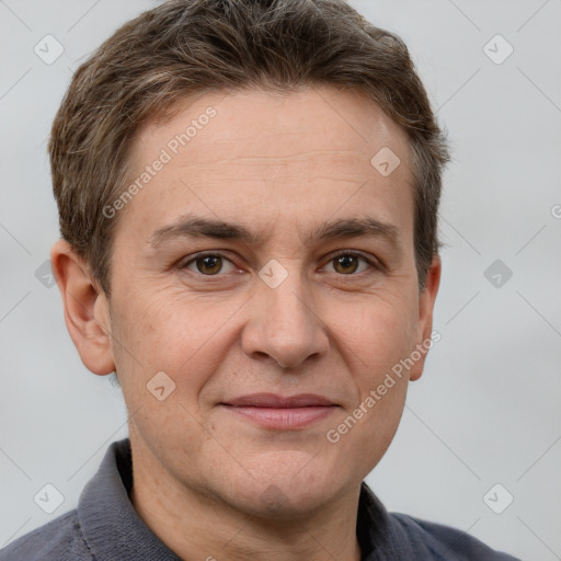 Joyful white adult male with short  brown hair and grey eyes