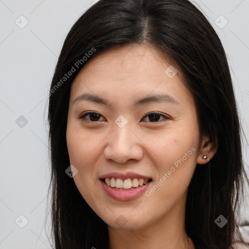 Joyful latino young-adult female with long  brown hair and brown eyes