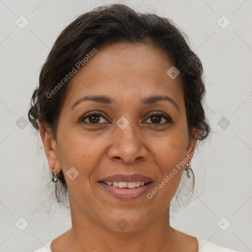 Joyful latino adult female with medium  brown hair and brown eyes