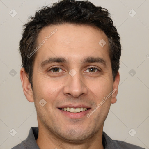 Joyful white adult male with short  brown hair and brown eyes