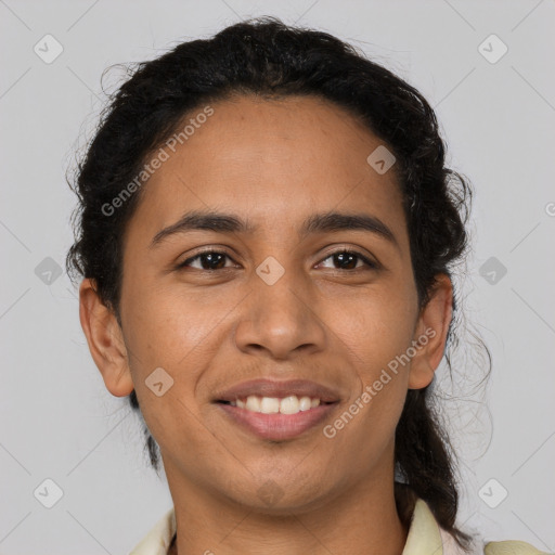 Joyful latino young-adult male with short  brown hair and brown eyes