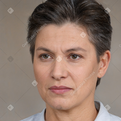 Joyful white adult female with short  brown hair and brown eyes