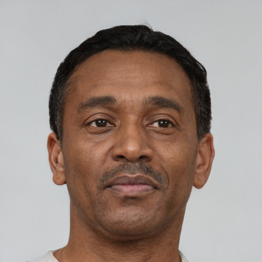 Neutral latino adult male with short  black hair and brown eyes