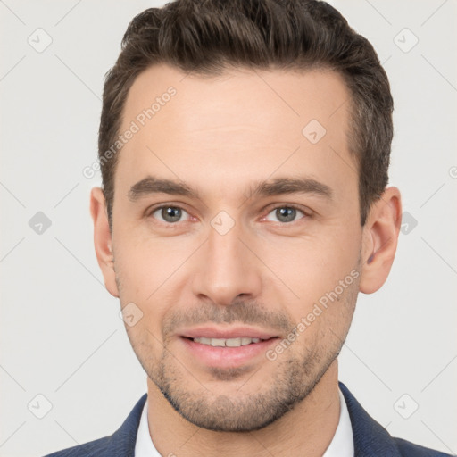 Joyful white young-adult male with short  brown hair and brown eyes