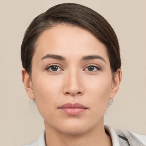 Neutral white young-adult female with short  brown hair and brown eyes