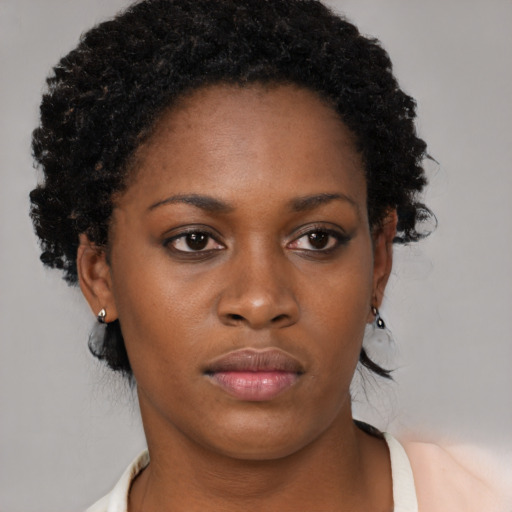 Neutral black young-adult female with short  brown hair and brown eyes