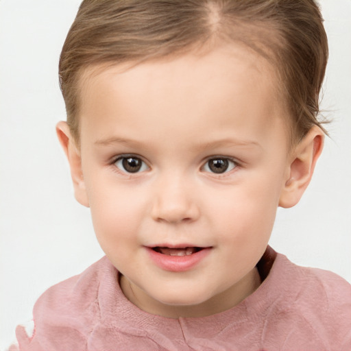 Joyful white child female with short  brown hair and brown eyes