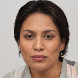 Joyful white adult female with medium  brown hair and brown eyes